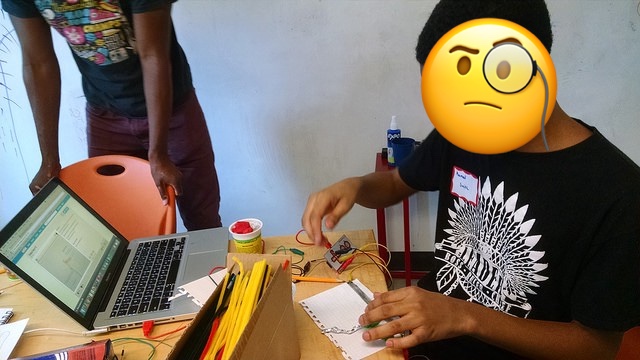 A photo of a boy using a Makey Makey