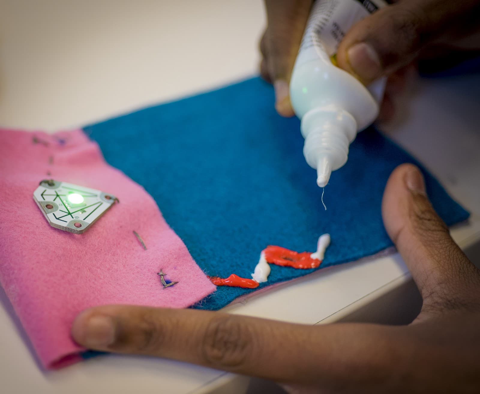 A photo of a student making a fabric case